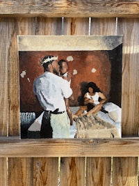 a painting on a wooden fence